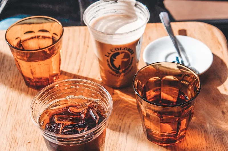 Iced coffees on a wooden tray